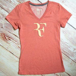 Nike Dri-fit orange top.  Roger Federer. Tennis